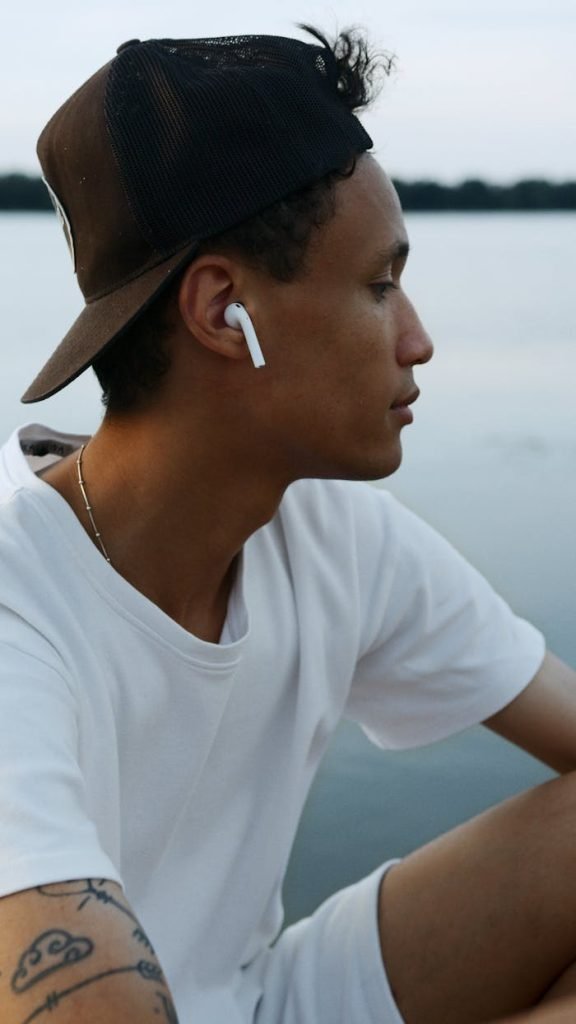 Man wearing wireless earbuds enjoying 3C Nexus audio products